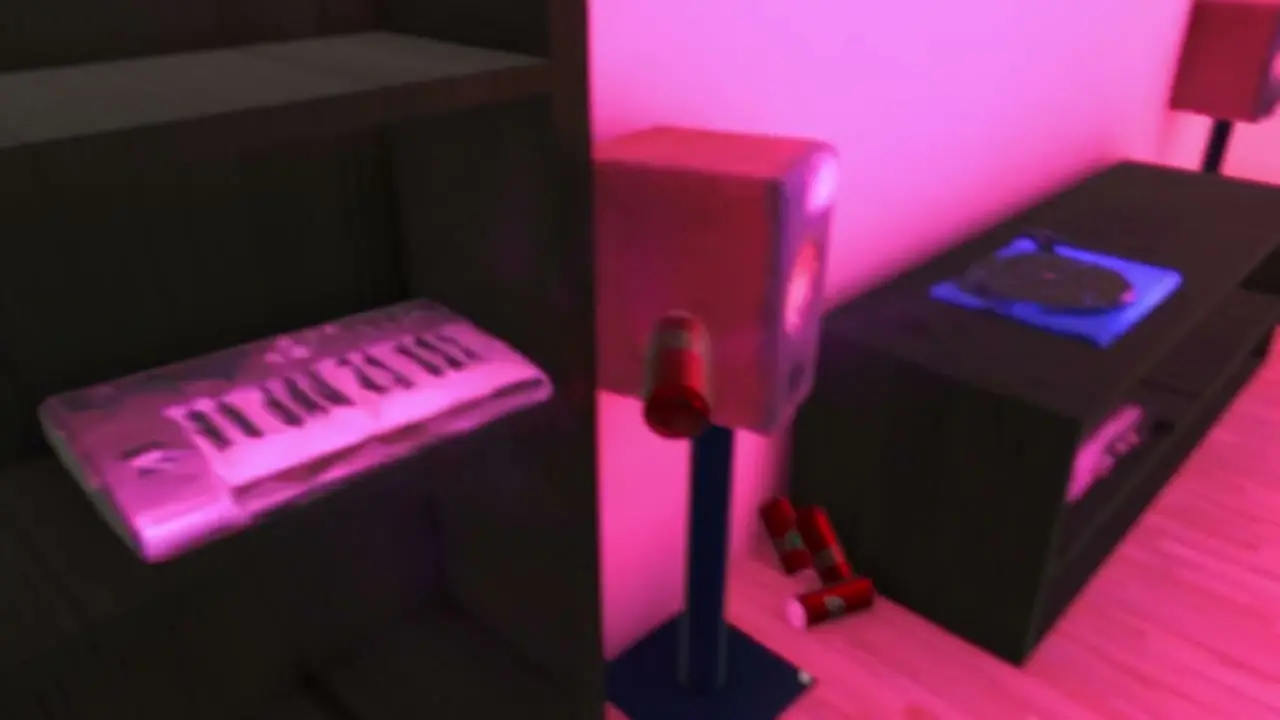 The keyboard and speaker under magenta light