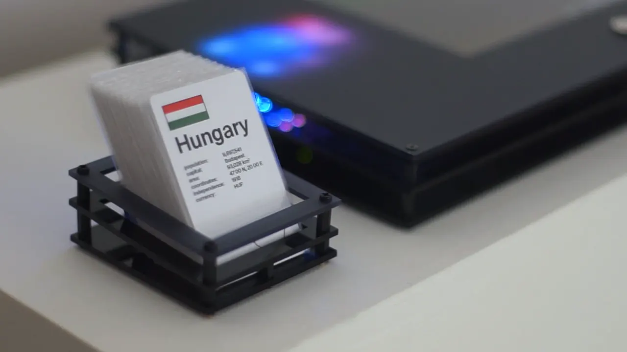 A Hungary card in the reader, the board glowing blue