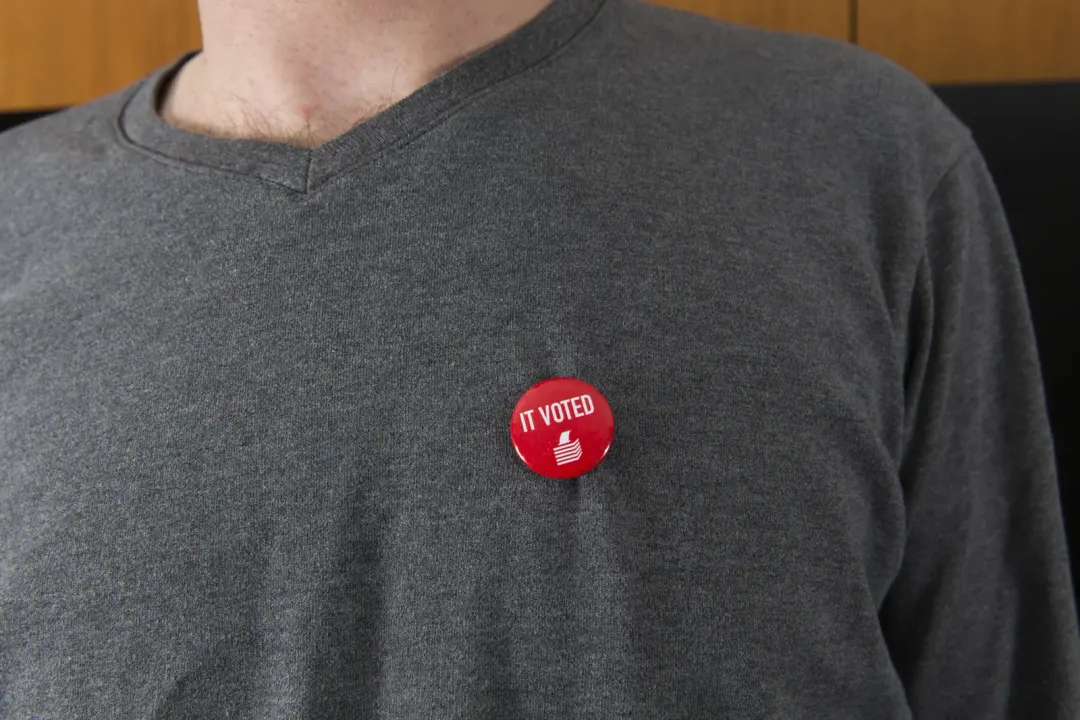 An ‘I voted’ badge on a grey sweater