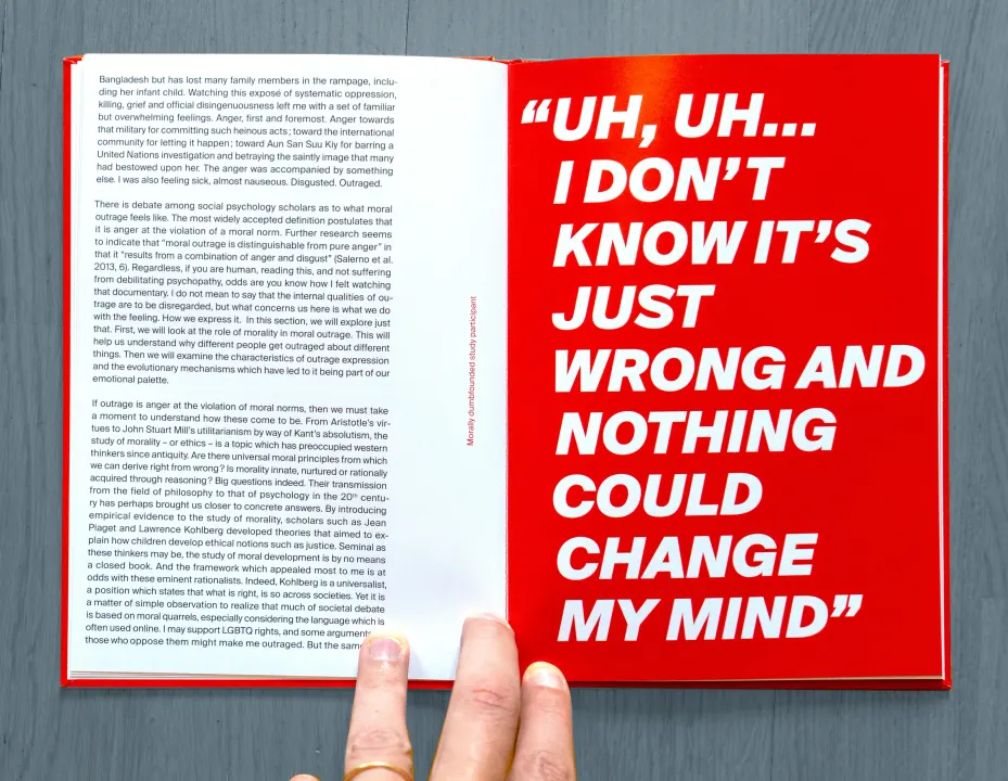 A spread from Outrage!: text on the left, a quote in white capitals on a red page